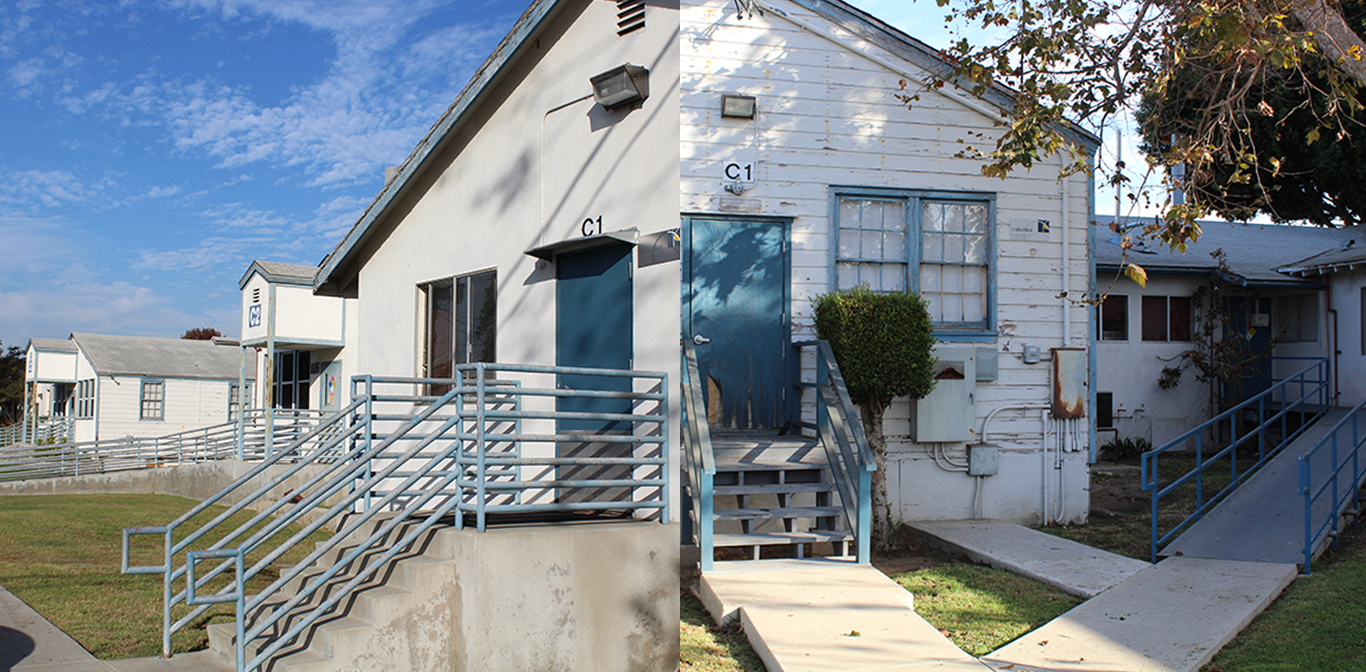 Older white building with blue trim labeled C1 and C2