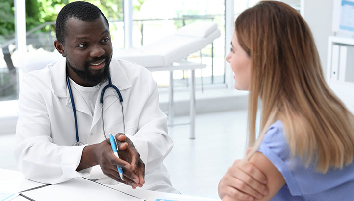 Doctor talking with patient