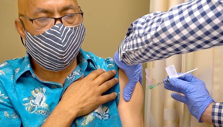 Man receiving covid-19 vaccine