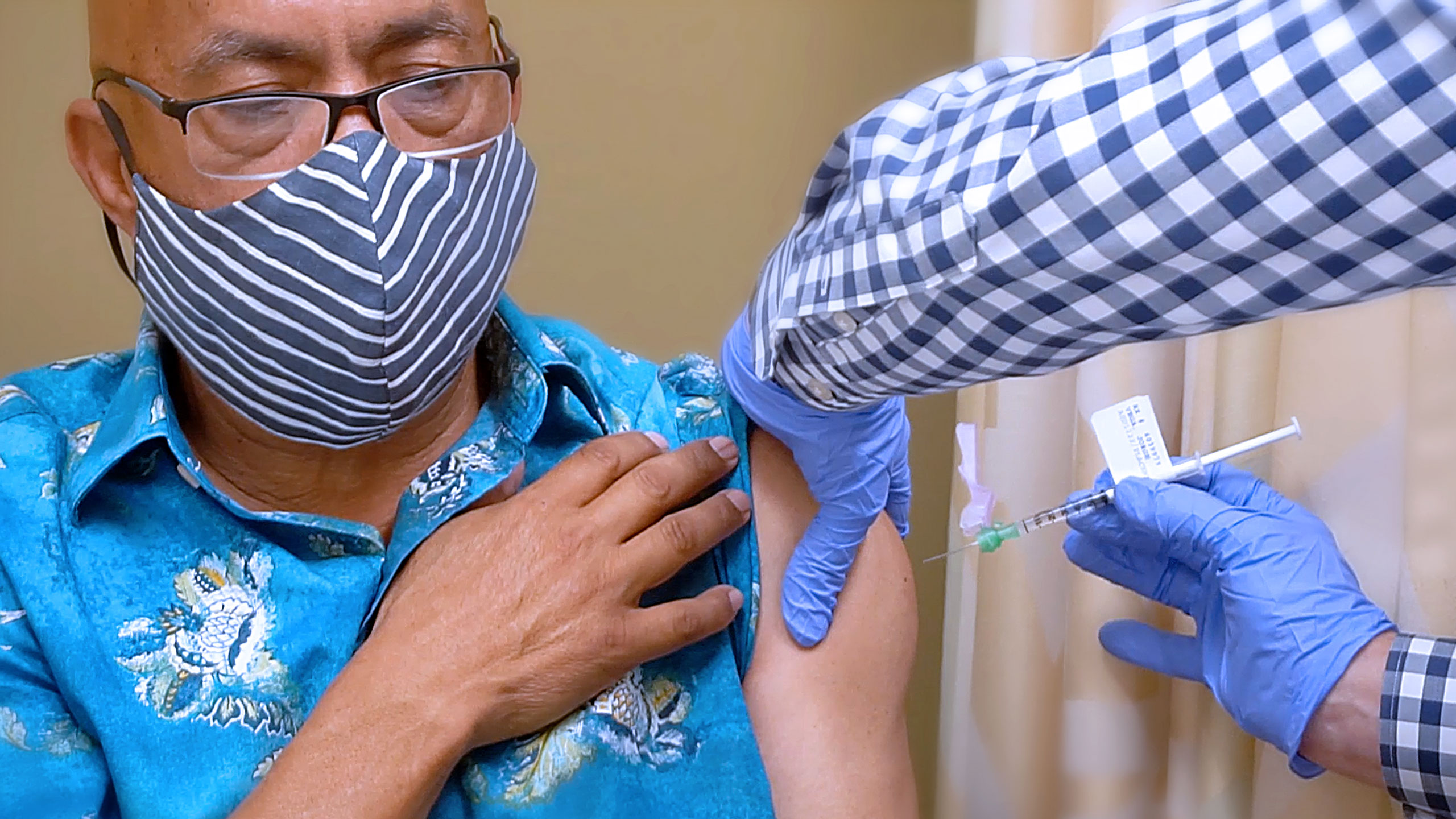 Man receiving covid-19 vaccine