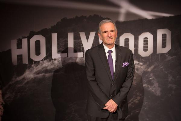 Spirit of Innovation Gala attendee in front of Hollywood sign backdrop