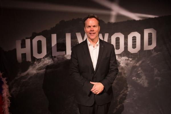 Spirit of Innovation Gala attendee in front of Hollywood sign backdrop