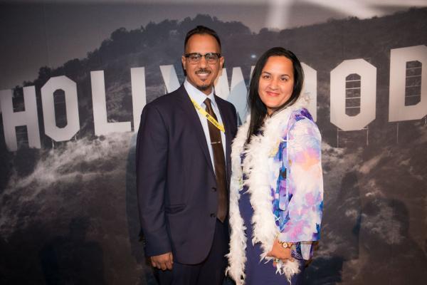 Spirit of Innovation Gala attendees in front of Hollywood sign backdrop