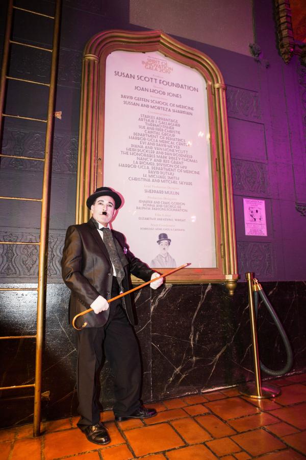 Charlie Chaplin impersonator in front of Spirit of Innovation Gala sign