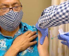 Man receiving covid-19 vaccine